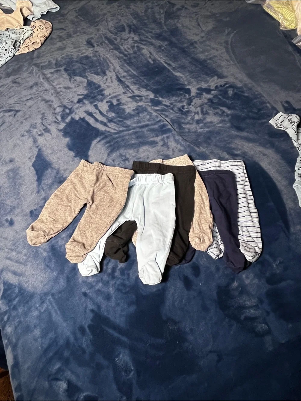 Newborn shirts and pants  9 pc bundle.  3 tops & 6 footed pants